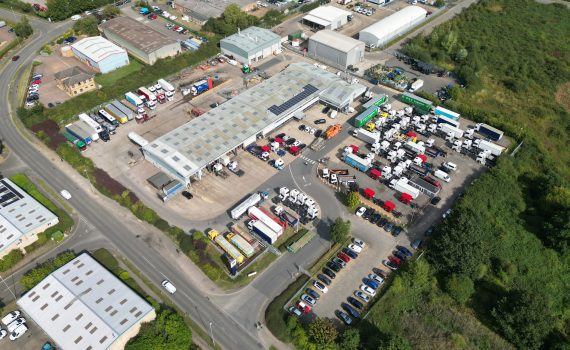 Aerial top-down view of HGV maintenance depot roof in Northampton for drone inspection