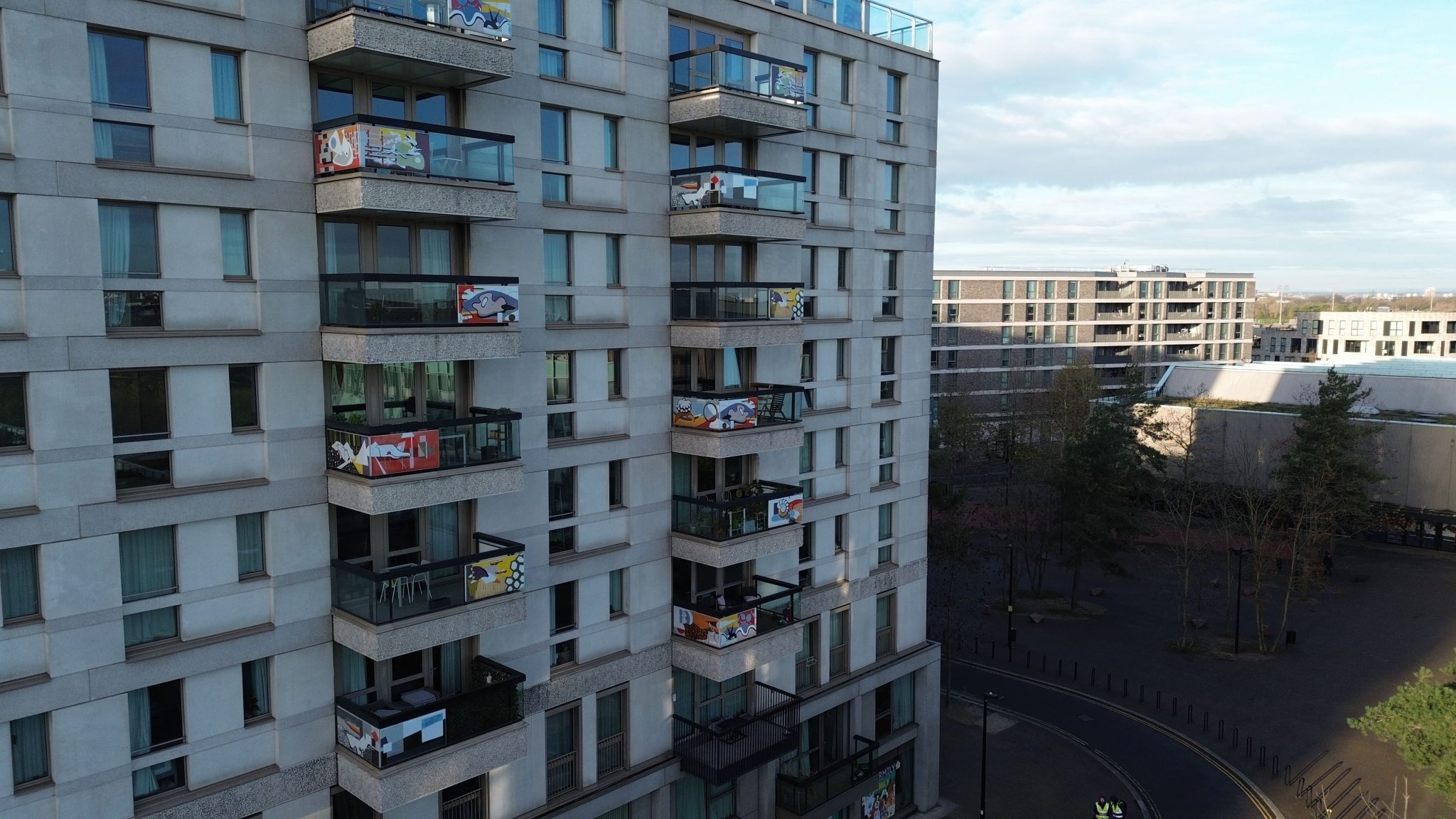 Contextual drone image showing multiple balconies on a residential block at East Village for condition inspection.