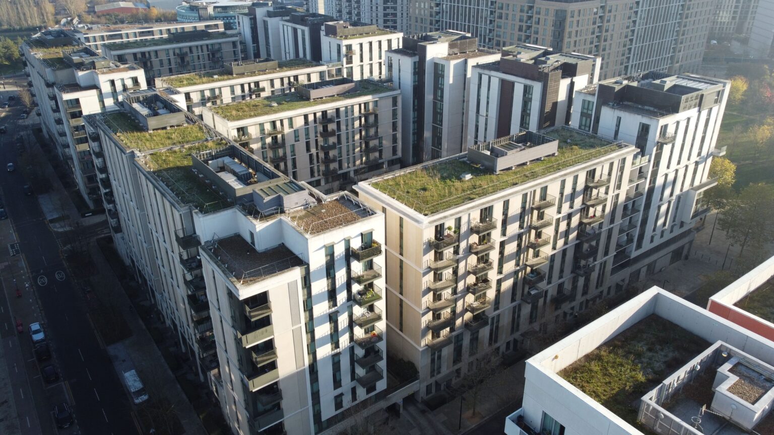 Aerial view of East Village in Stratford showing multiple residential blocks and repetitive balcony arrangements across the development.