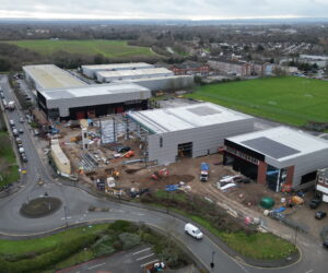 High-level aerial view showing the development nearing completion, with building envelopes complete and external works progressing.
