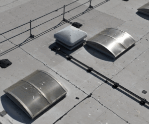 Aerial roof inspection imagery showing rooflights, roof coverings, penetrations and rainwater goods across the distribution centre.