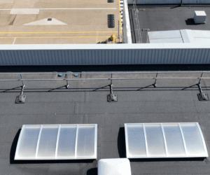 Aerial roof inspection imagery showing rooflights, roof coverings, penetrations and rainwater goods across the distribution centre.