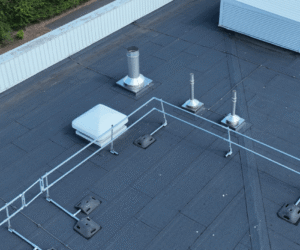 Aerial roof inspection imagery showing rooflights, roof coverings, penetrations and rainwater goods across the distribution centre.